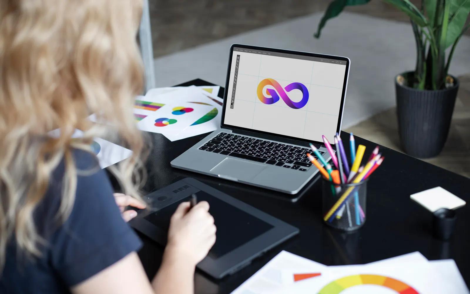 Designer working on a brand logo on a graphics tablet